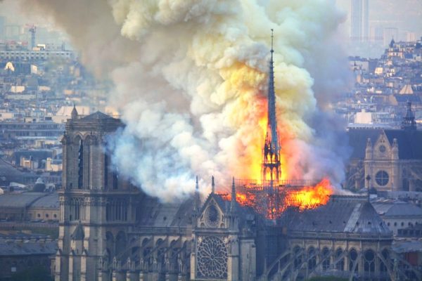 Smoke and flames rise during a fire at Notre Dame Cathedral landmark