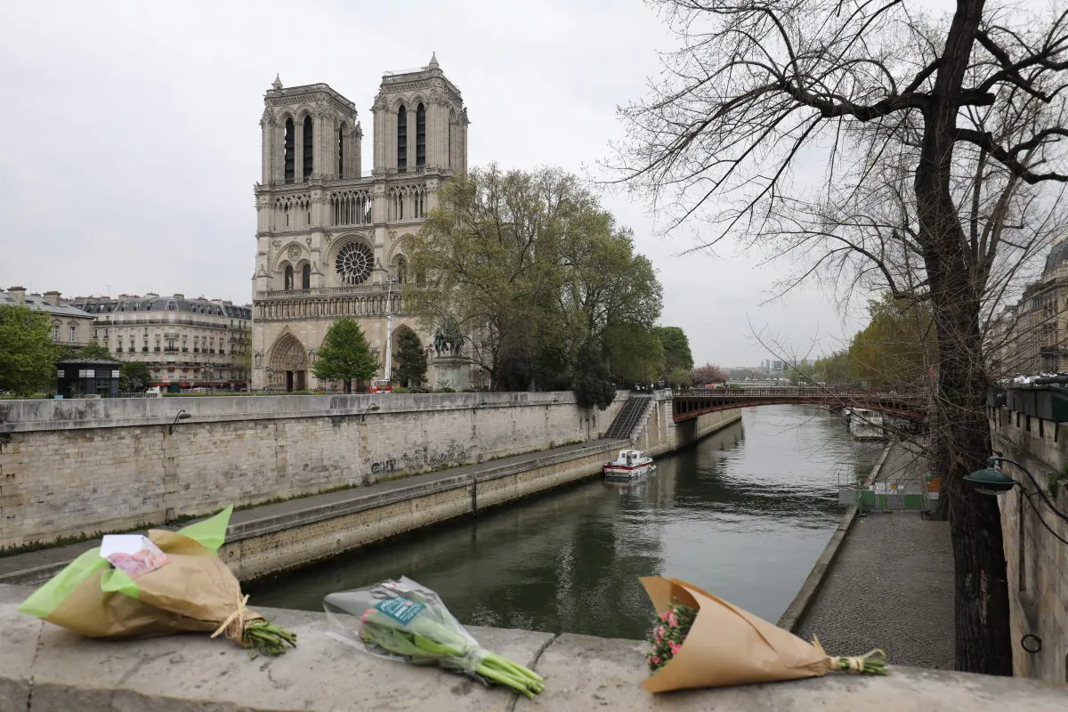 Roses have been laid near Notre Dame de Paris cathedral a day after a fire devastated the cathedral in central Paris on April 16, 2019. (Ludovic Marin/AFP/Getty Images)
