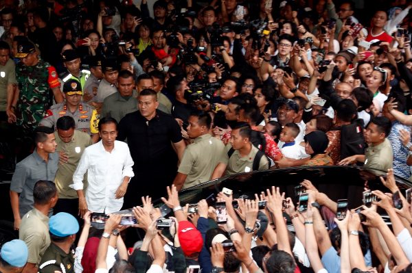 Indonesia's President Joko Widodo reacts after a quick count result