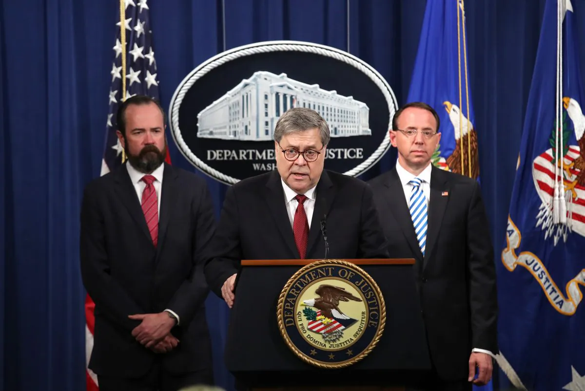 Attorney General William Barr speaks about the release of the redacted version of the Mueller report as U.S. Deputy Attorney General Rod Rosenstein (R) and U.S. Acting Principal Associate Deputy Attorney General Ed O’Callaghan listen at the Department of Justice on April 18, 2019. (Win McNamee/Getty Images)