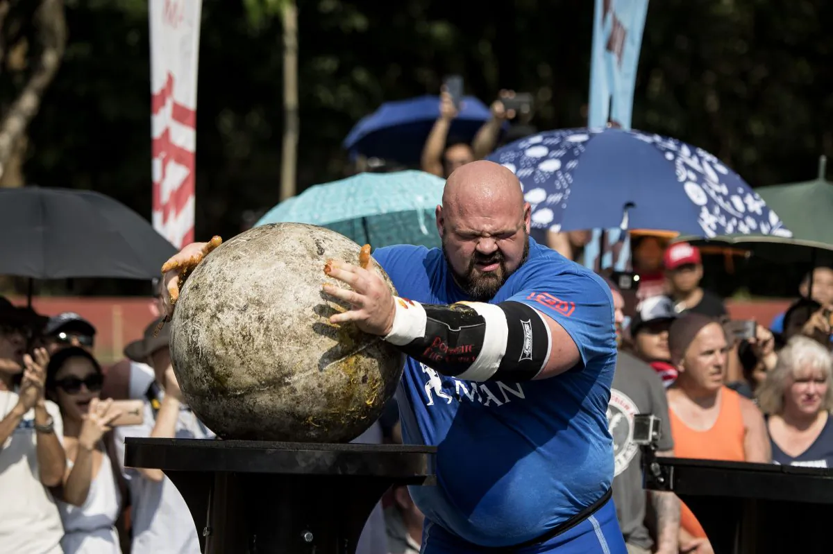Brian Shaw of the United States lifts a concrete sphere during the Atlas Stones competition of the 2018 World's Strongest Man in Manila, Philippines, on May 6, 2018. (Noel Celis/AFP/Getty Images)