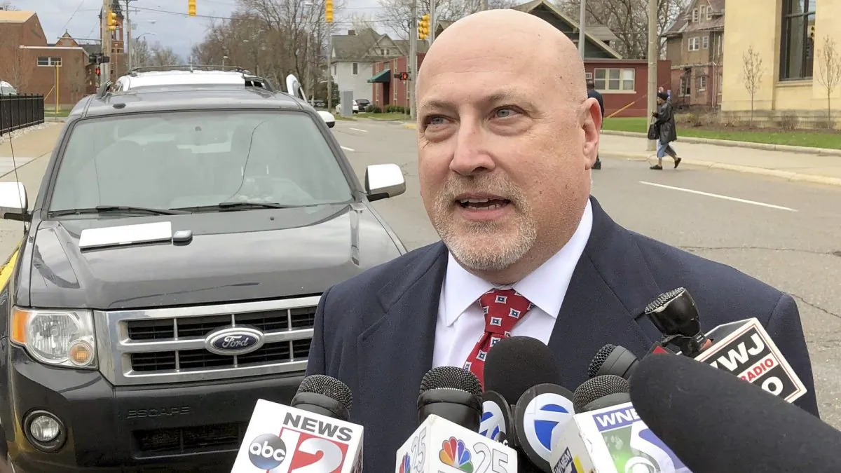 Retired Bishop Airport police Lt. Jeff Neville speaks to reporters outside the federal courthouse in Flint, Mich., on April 18, 2019. Amor Ftouhi, of Canada, convicted of terrorism for nearly killing Neville in June 2017, was sentenced Thursday to life in prison after defiantly declaring he had no regrets and only wished he had carried a machine gun that day instead of a knife. (Ed White/AP Photo)