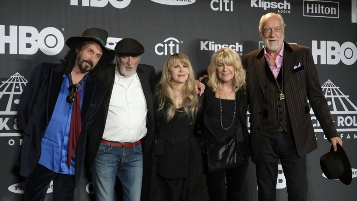 Inductee Stevie Nicks, center, posing with other members of Fleetwood Mac at the Rock & Roll Hall of Fame induction ceremony in New York on March 29, 2019. Fleetwood Mac has announced rescheduled dates for its North America tour which were postponed earlier this month because singer Stevie Nicks had the flu. (Charles Sykes/Invision/AP, File)