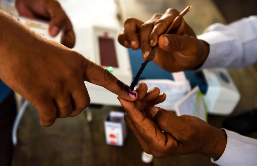 An Indian voter gets her finger marked with ink at a polling station during India's general election in Shahpur, Uttar Pradesh, on April 11, 2019. (Money Sharma/AFP/Getty Images)