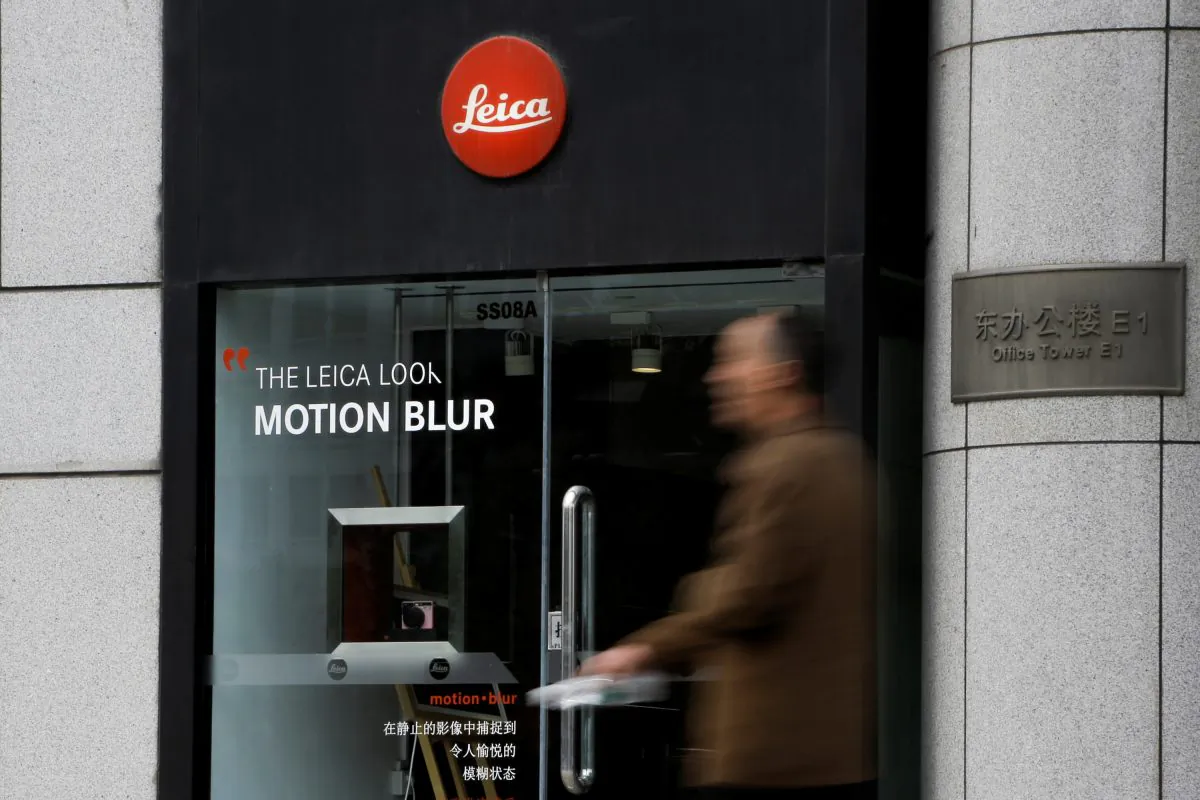A man walks past a Leica camera store in Beijing on April 19, 2019. (Thomas Peter/Reuters)