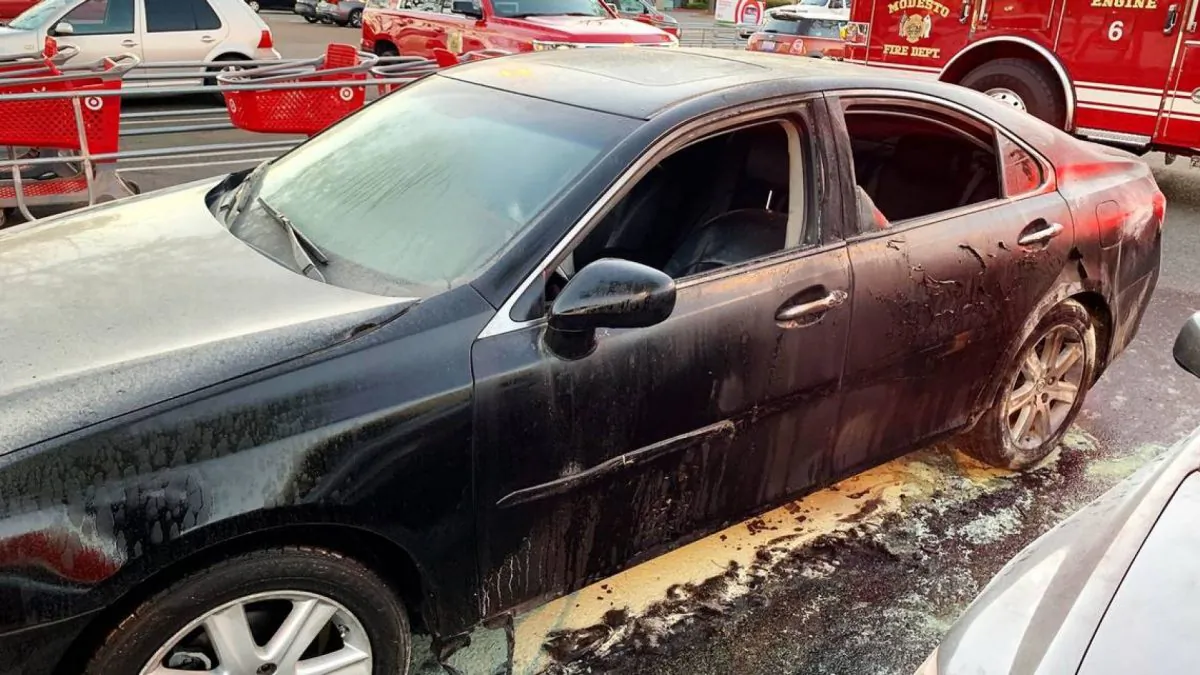 A car damaged by fire in the parking lot of a Target store in Modesto, Calif., on April 17, 2019. (Modesto Fire Department)