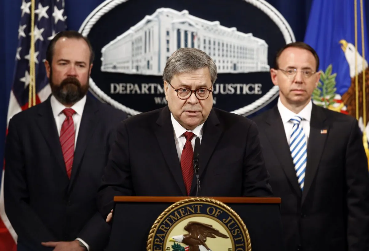 Attorney General William Barr speaks alongside Deputy Attorney General Rod Rosenstein (R), and acting Principal Associate Deputy Attorney General Edward O'Callaghan (L), about the release of a redacted version of special counsel Robert Mueller's report during a news conference at the Department of Justice in Washington, on April 18, 2019. (Patrick Semansky/AP Photo)