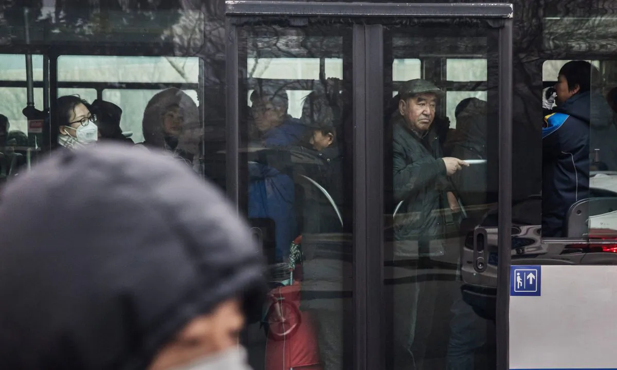 People on a full bus in China. (Kevin Frayer/Getty Images)