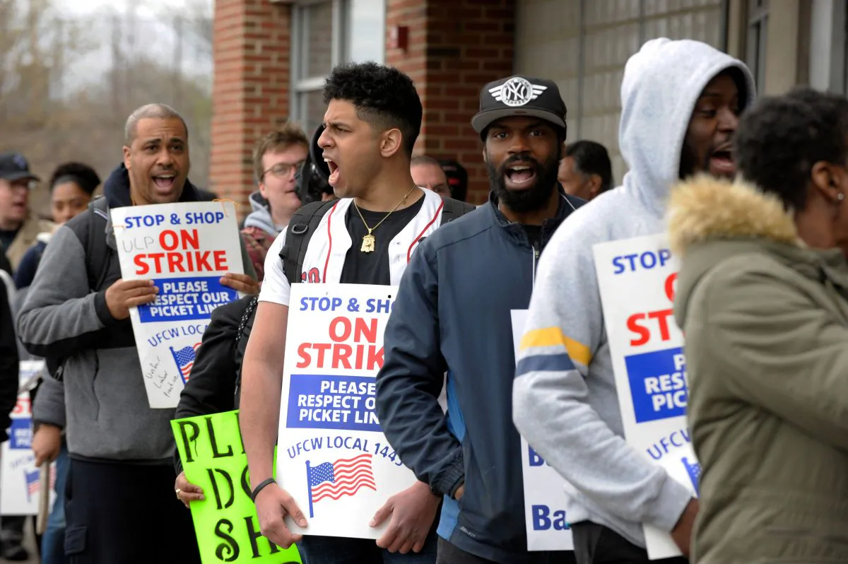 Stop and Shop workers and supporters march in a picket line at the Stop and Shop South Bay Plaza's entrance at a rally organized by UFCW Union members and attended by former US vice president Joe Biden to support Stop and Shop employees on strike throughout the region at the Stop and Shop in Dorchester, Massachusetts, on April 18, 2019. JOSEPH PREZIOSO/AFP/Getty Images