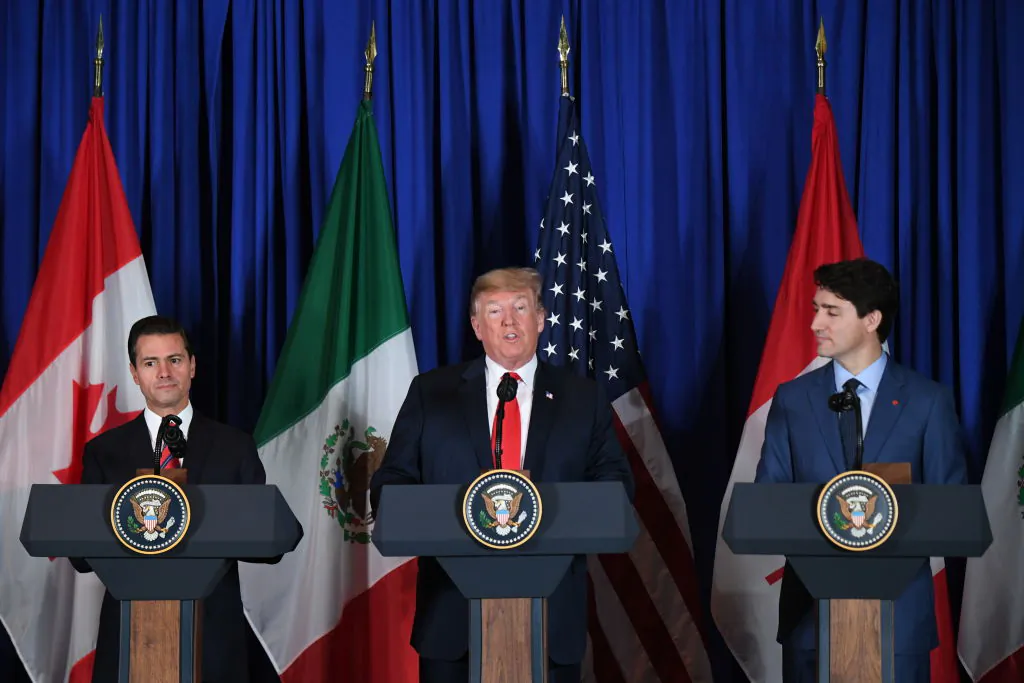 (L to R) Mexican President Enrique Pena Nieto, U.S. President Donald Trump, and Canadian Prime Minister Justin Trudeau deliver a statement on the signing of the USMCA trade agreement in Buenos Aires on the sidelines of the G20 Leaders' Summit, on Nov. 30, 2018. (MARTIN BERNETTI/AFP/Getty Images)