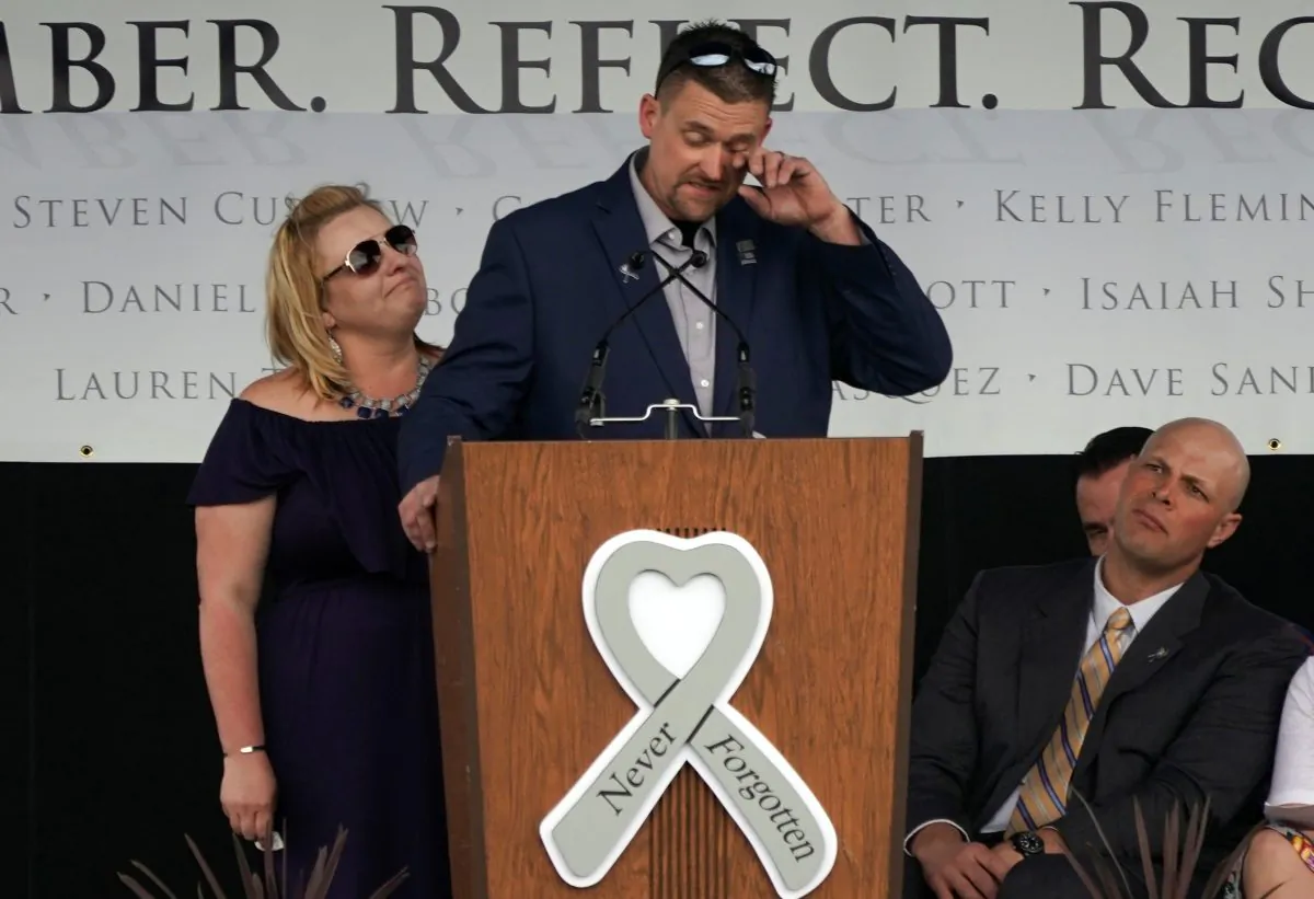 Sean Graves, shot six times in the Columbine high school shooting, sheds a tear with his wife Kara at his side at a ceremony to commemorate the 20th anniversary of the attack in Littleton, Colorado, U.S., April 20, 2019. (Rick Wilking/Reuters)