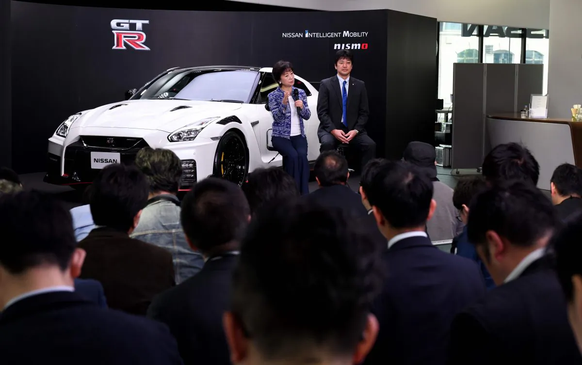 Nissan senior vice president Asako Hoshino (L) and corporate vice president Kinichi Tanuma (R) hold a question and answer session in front of the 2020 model of the Nissan GT-R NISMO at Nissan Crossing, the company's flagship showroom, during a promotional event in Tokyo on April 17 2019. (Toshifumi Kitamura/AFP/Getty Images)
