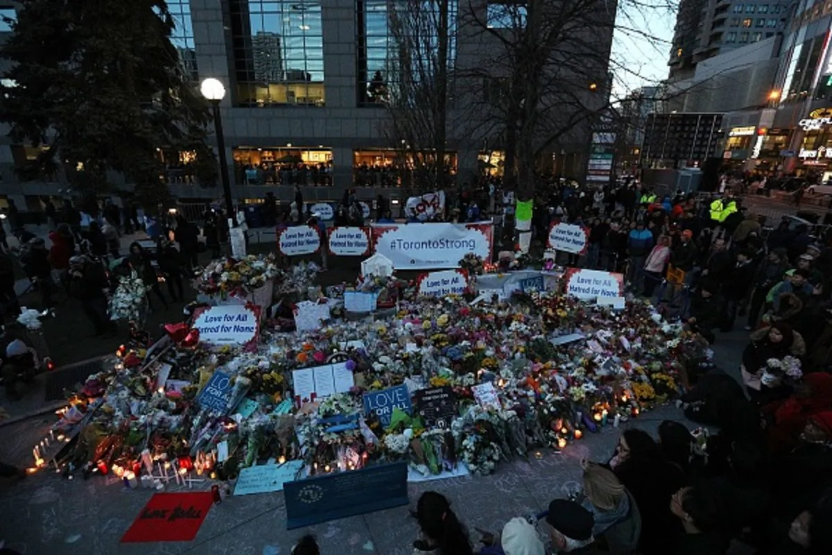 Candles surround a makeshift memorial in Mel Lastman Square in Toronto for the victims of the van attack before a vigil on April 29, 2018.  (Lars Hagberg/AFP/Getty Images)