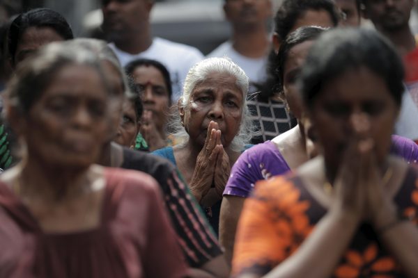 People pay tribute to victims