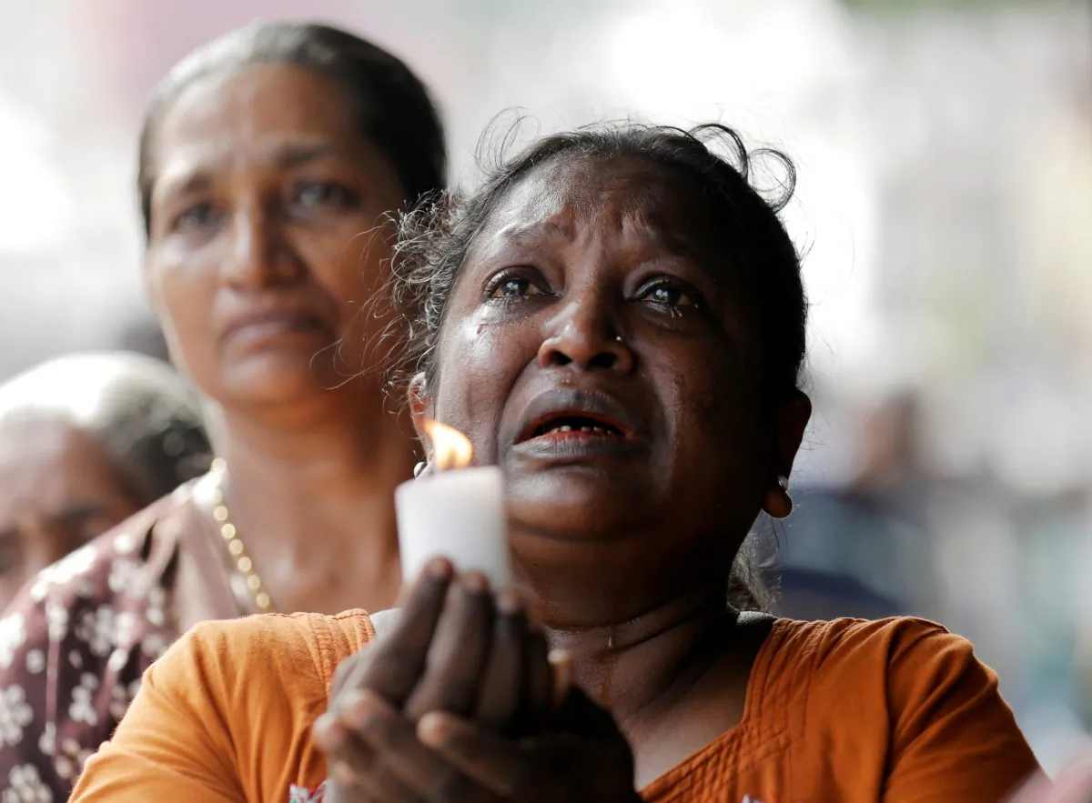 Silence is observed as a tribute to victims, two days after a string of suicide bomb attacks on churches and luxury hotels on Easter Sunday, during a memorial service in Colombo, Sri Lanka, on April 23, 2019. (Dinuka Liyanawatte/Reuters)