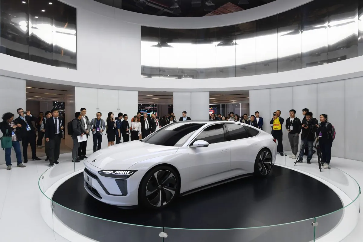 Visitors look at a Nio ET Preview car on the opening day of the Shanghai Auto Show in Shanghai, China, on April 16, 2019. (Greg Baker/AFP/Getty Images)
