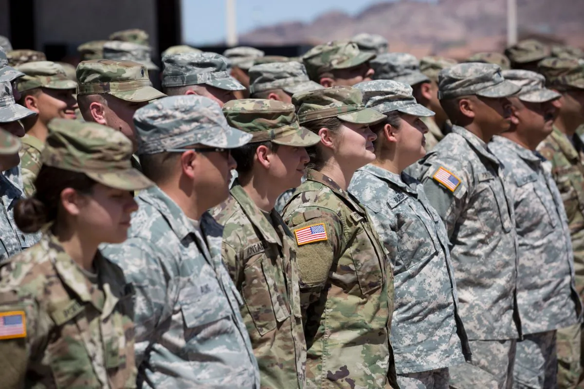 Members of the Arizona National Guard listen to instructions at the Papago Park Military Reservation in Phoenix, on April 9, 2018. (Caitlin O'Hara/ /AFP/Getty Images)