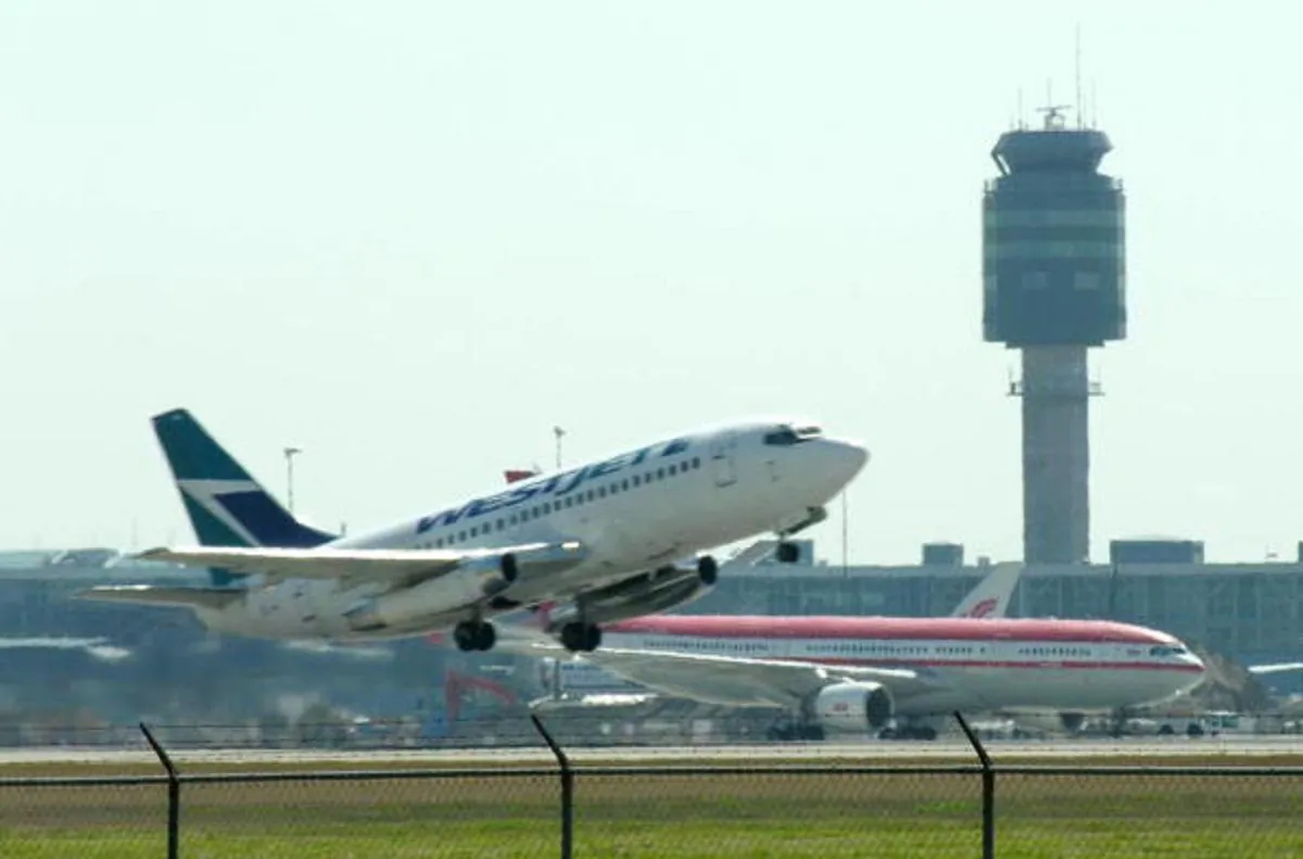 An airplane takes off from Vancouver International Airport on Aug. 13, 2005. (Cathryn Atkinson/AFP/Getty Images)
