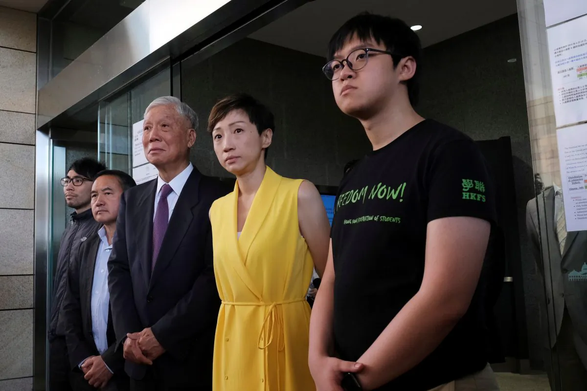 (L-R) Pro-democracy activists Chung Yiu-wa, Lee Wing-tat, Chu Yiu-ming, Tanya Chan and Cheung Sau-yin leave the court after getting their suspended sentence on their involvement in the Occupy Central, also known as "Umbrella Movement," in Hong Kong, China on April 24, 2019. (Tyrone Siu/Reuters)