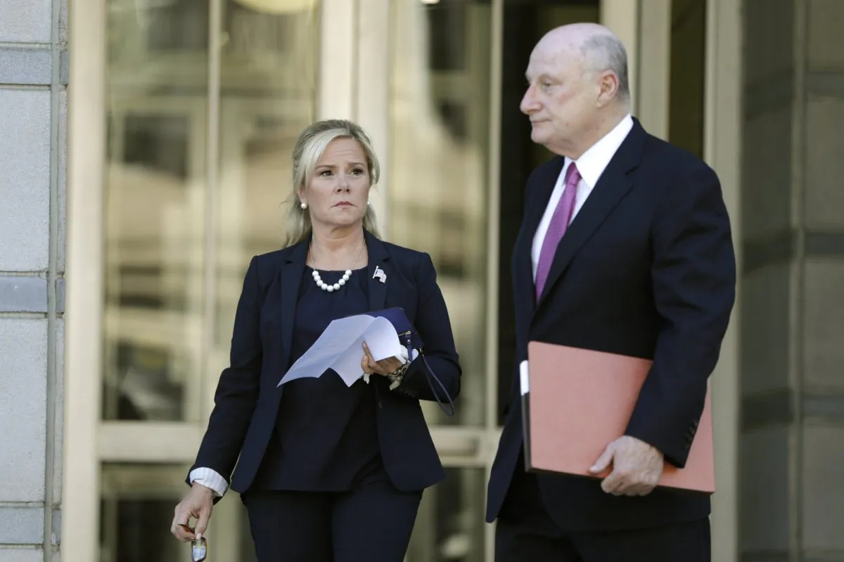 Bridget Kelly, left, the former deputy chief of staff for former New Jersey Gov. Chris Christie, walks with her lawyer Michael Critchley while leaving the Martin Luther King, Jr., Federal Courthouse after a re-sentencing hearing in Newark, N.J., on April 24, 2019. (Julio Cortez/AP Photo)