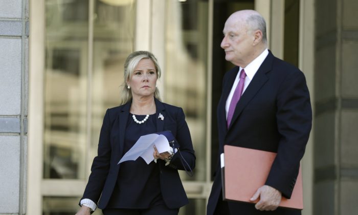 Bridget Kelly, left, the former deputy chief of staff for former New Jersey Gov. Chris Christie, walks with her lawyer Michael Critchley while leaving the Martin Luther King, Jr., Federal Courthouse after a re-sentencing hearing in Newark, N.J., on April 24, 2019. (Julio Cortez/AP Photo)