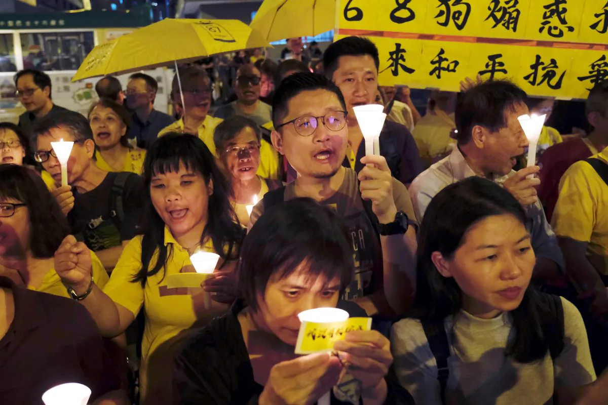 Pro-democracy supporters attend candlelight vigils to support four jailed leaders of the 2014 pro-democracy "Occupy" movement, also known as "Umbrella Movement," outside Lai Chi Kok Reception Center in Hong Kong, China on April 24, 2019. (Tyrone Siu/Reuters)