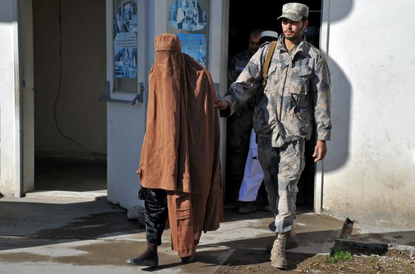 burqa-clad Taliban fighter
