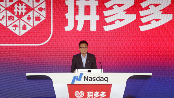 Colin Huang, founder and CEO of the online group discounter Pinduoduo, speaks during the company's stock trading debut at the Nasdaq Stock Market in New York, during an event in Shanghai