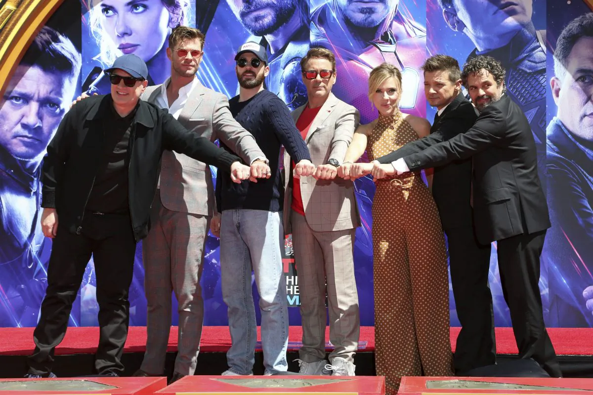 Marvel Studios President Kevin Feige, from left, poses with members of the cast of "Avengers: Endgame," Chris Hemsworth, Chris Evans, Robert Downey Jr., Scarlett Johansson, Jeremy Renner and Mark Ruffalo at a hand and footprint ceremony at the TCL Chinese Theatre on April 23, 2019, in Los Angeles. (Willy Sanjuan/Invision/AP)