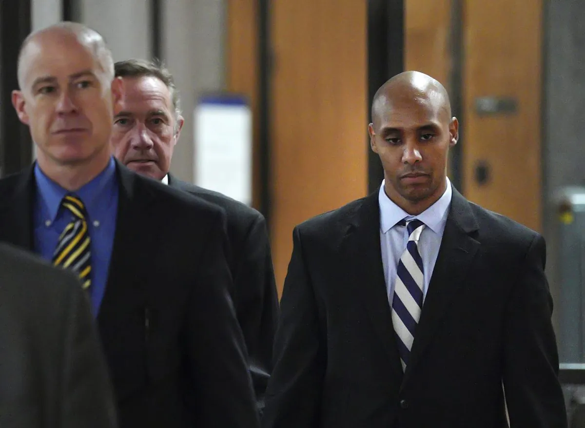 Former Minneapolis police officer Mohamed Noor, right, with attorneys Peter Wold, center, and Thomas Plunkett, left, walks out of the the Hennepin County Government Center Thursday, April 25, 2019. (Brian Peterson/Star Tribune/AP)