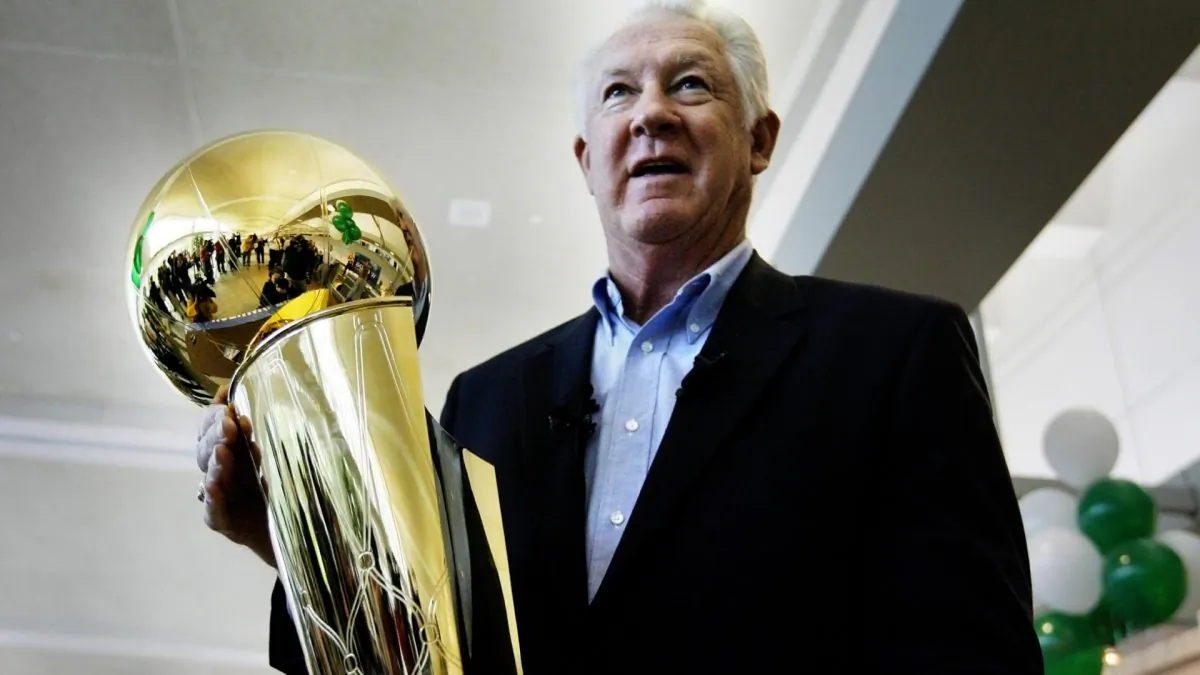 NBA legend John Havlicek holds the Larry O'Brien NBA Championship Trophy at Manchester Boston Regional Airport in Manchester, N.H., on June 4, 2008. (Cheryl Senter/File photo via AP)