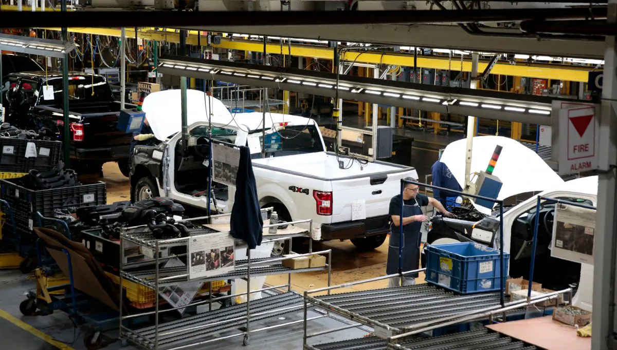 An employee works on the assembly line for the Ford 2018 and 2019 F-150 truck at the Ford Motor Company's Rouge Complex in Dearborn, Mich., on Sept. 27, 2018. (JEFF KOWALSKY/AFP/Getty Images)