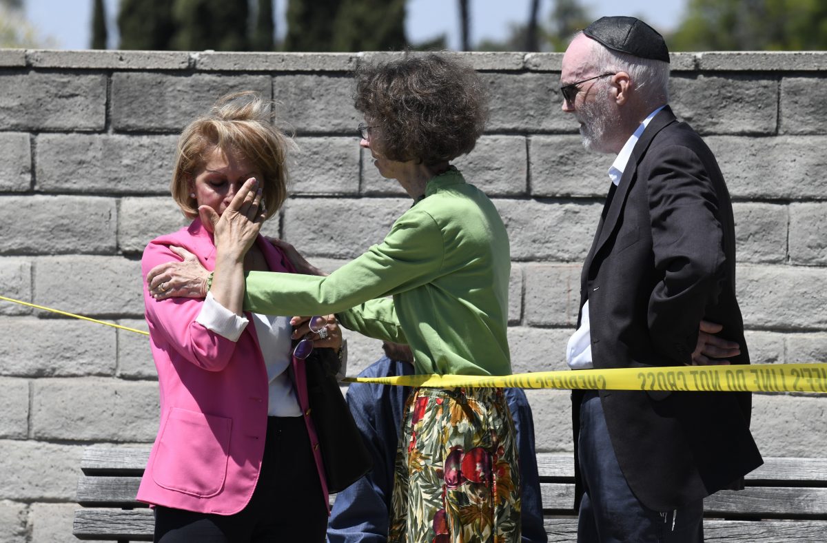 Synagogue members console one another