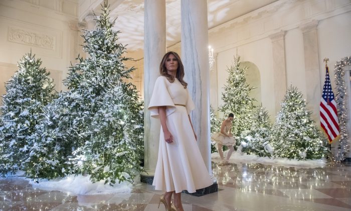 First Lady Melania Trump stands in the grand foyer at the White House in Washington on Nov. 27, 2017. (Saul Loeb/AFP/Getty Images)