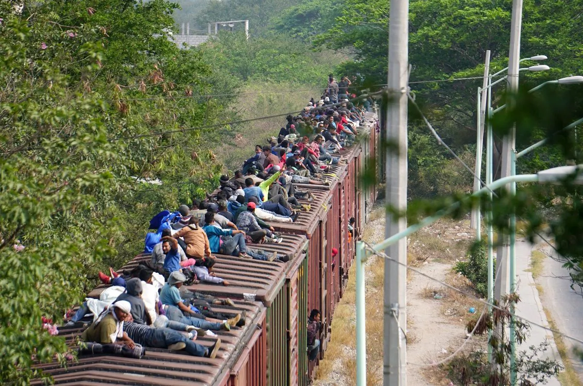 Central American migrants, moving in a caravan through Juchitan, Oaxaca, in Mexico are pictured atop a train known as "The Beast" while continuing their journey toward the United States on April 26, 2019. (Jose Cortes/Reuters)