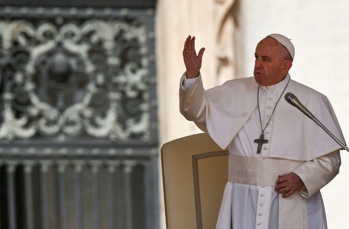 Pope Francis waves to pilgrims upon his arrival on stage at St. Peter's Square in The Vatican on April 24, 2019, during his weekly general audience. (VINCENZO PINTO/AFP/Getty Images)