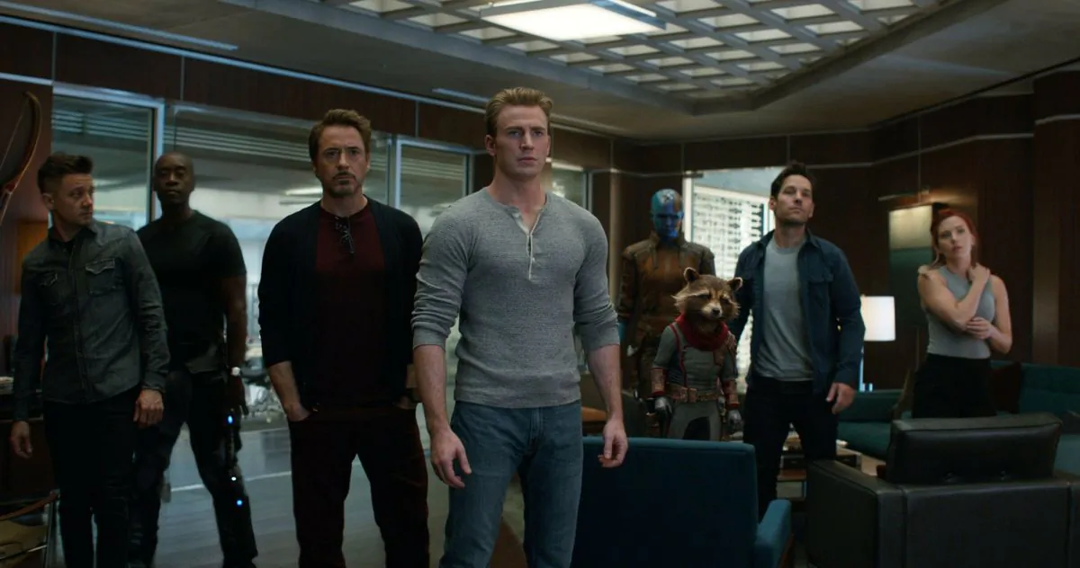 From left, Jeremy Renner, Don Cheadle, Robert Downey Jr., Chris Evans, Karen Gillan, the character Rocket, voiced by Bradley Cooper, Paul Rudd and Scarlett Johansson in a scene from "Avengers: Endgame." (Disney/Marvel Studios via AP)