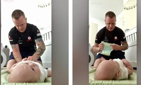 Tattooed Dad’s Hilarious Reaction as He Gags and Almost Vomits While Changing Baby’s Diaper