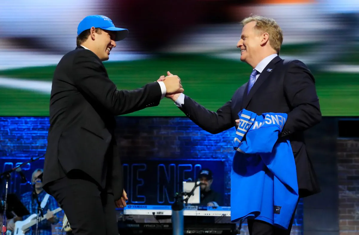 T.J. Hockenson of Iowa greets NFL Commissioner Roger Goodell after being chosen No. 8 overall by the Detroit Lions during the first round of the 2019 NFL Draft in Nashville, Tenn., on April 25, 2019 . Andy Lyons/Getty Images