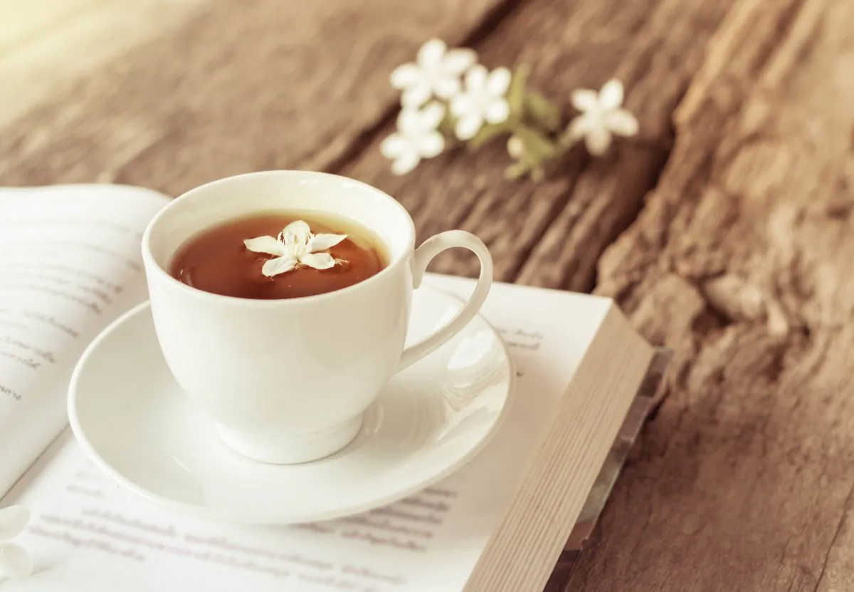 A great way to take care of Mom is to give her some time for relaxation, perhaps with a cup of tea and a good book. (nednapa/Shutterstock)