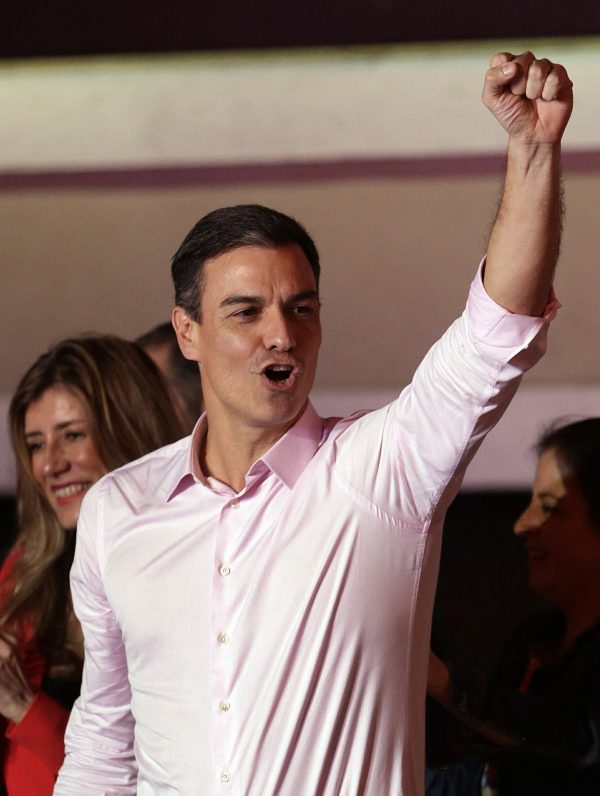 Spanish Prime Minister and Socialist Party candidate Pedro Sanchez gestures to supporters gathered