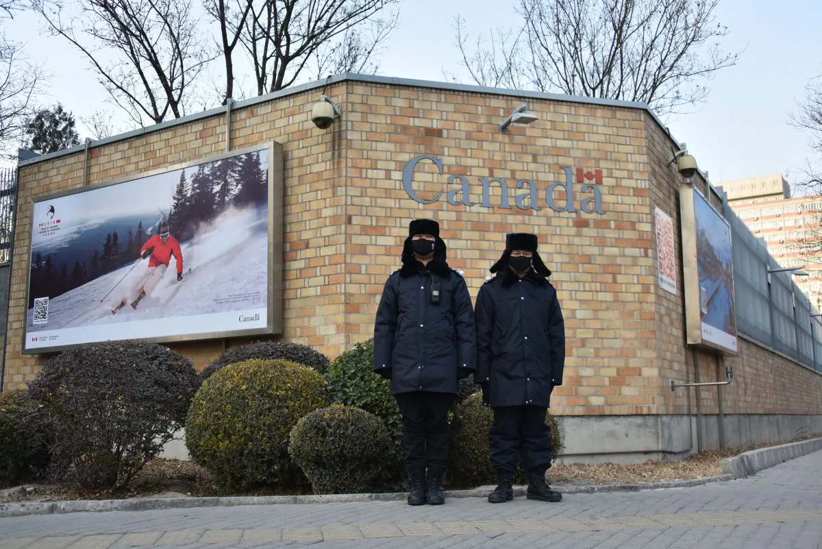 Chinese police officers stand guard outside the Canadian Embassy in Beijing on Dec. 10, 2018. (Greg Baker/AFP/Getty Images)