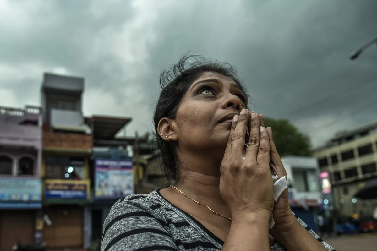 Sri Lankan local people pray near to St Anthony Church on April 23, 2019 evening in Colombo, Sri Lanka.  Atul Loke/Getty Images