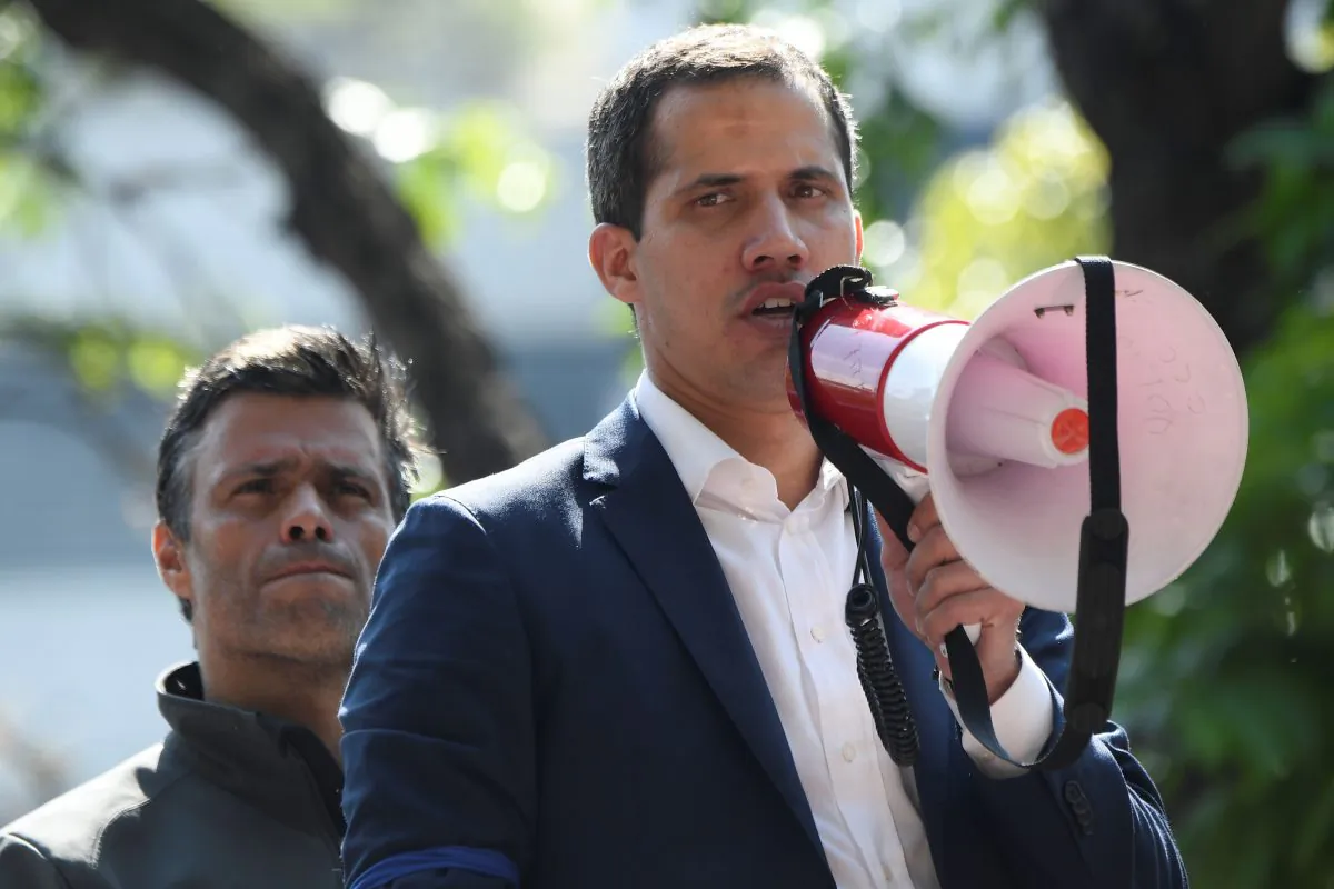 Venezuelan interim President Juan Guaidó speaks to supporters next to high-profile politician Leopoldo Lopez in Caracas on April 30, 2019. (Federico Parra/AFP/Getty Images)