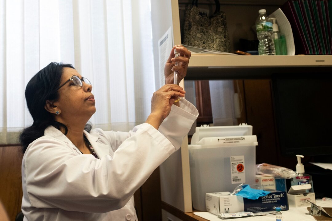 A nurse prepares the measles, mumps, and rubella vaccine in Rockland County, N.Y., on April 5, 2019. (Johannes Eisele /AFP/Getty Images)