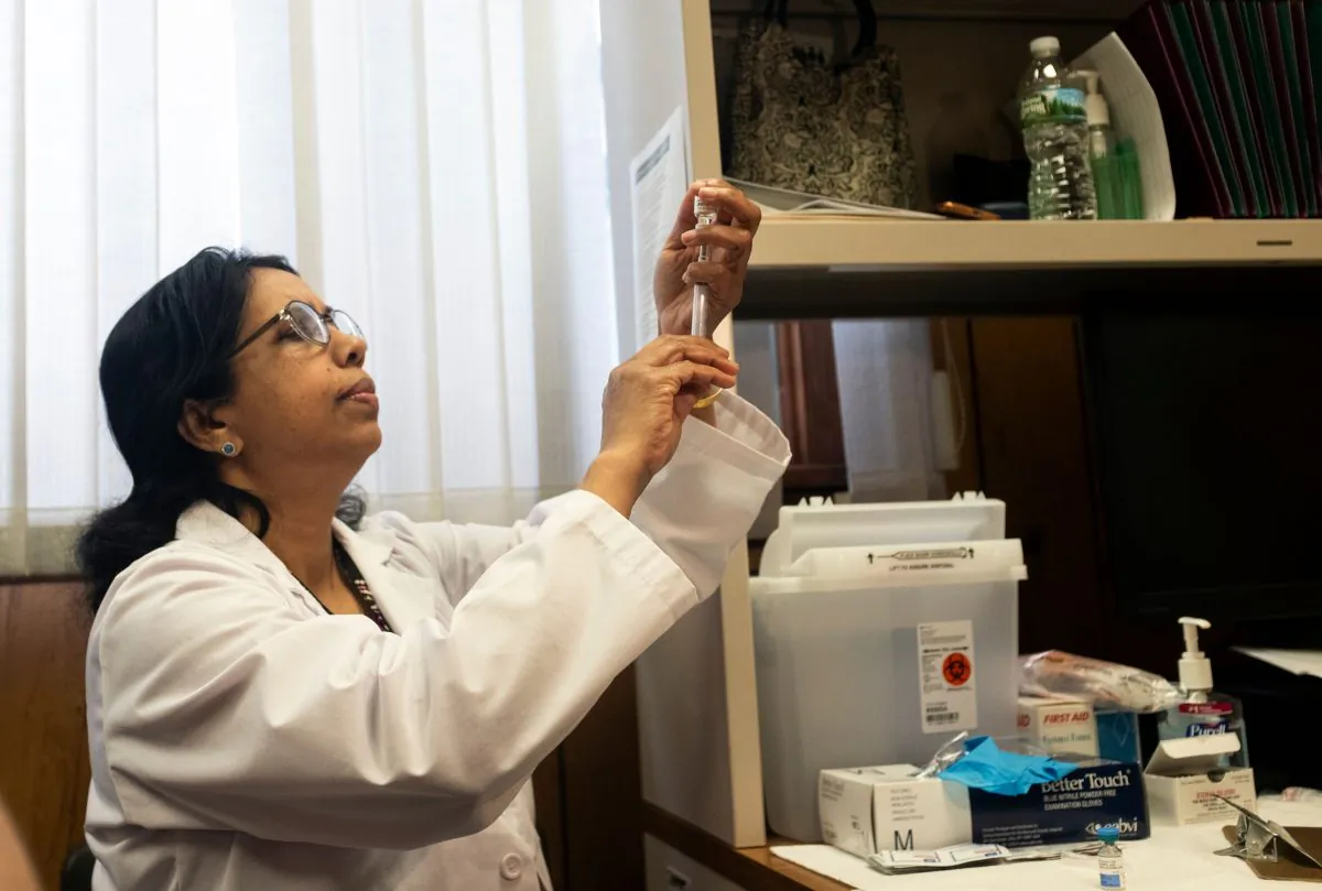 A nurse prepares the measles, mumps, and rubella vaccine in Rockland County, N.Y., on April 5, 2019.   (Johannes Eisele/AFP/Getty Images)