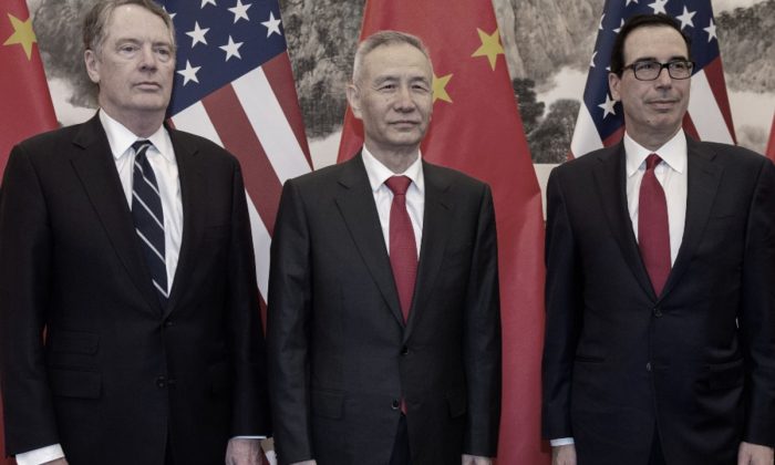 China's Vice Premier Liu He (C) pose for a photo with U.S. Treasury Secretary Steven Mnuchin (R) and U.S. Trade Representative Robert Lighthizer (L) at Diaoyutai State Guesthouse in Beijing on March 29, 2019. (Nicolas Asfouri/Pool via Reuters)