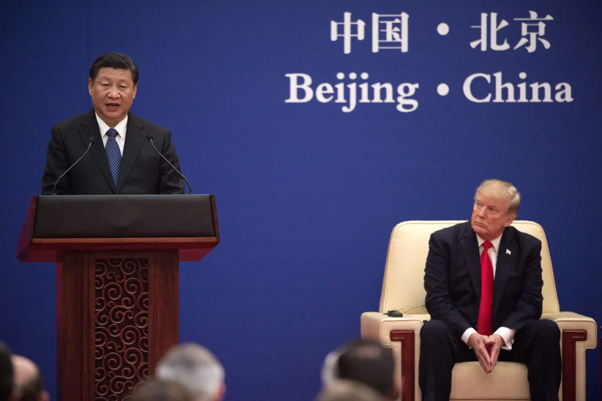China Communist Party leader Xi Jinping (L) speaks next to U.S. President Donald Trump during a business leaders event at the Great Hall of the People in Beijing on Nov. 9, 2017. (Nicolas Asfouri/AFP/Getty Images)