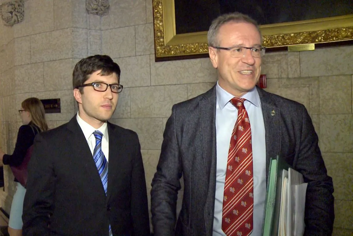 Conservative MP Garnett Genuis (L) and Liberal MP Borys Wrzesnewskyj on Parliament Hill on April 10, 2017. (NTD)
