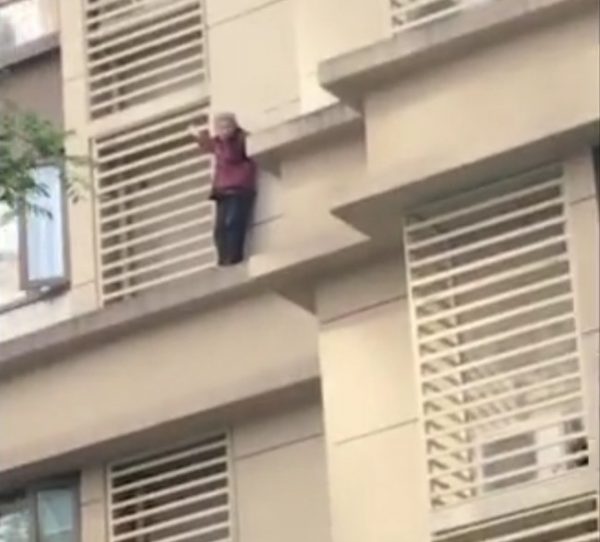 Woman climb building
